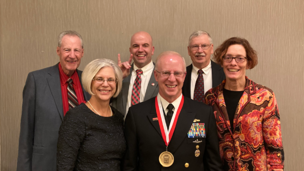 Photo from the ceremony: front row, left to right: Donna Caudle, Adm. Daryl Caudle, Prof. Sindee Simon. Back row, left to right: Frank Culbertson, Dean Jim Pfaendtner, Russ O'Dell.