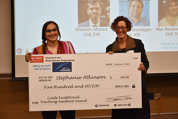 Sindee Simon presenting the Linde Exceptional Teaching Assistant Award check to award winner Stephanie Atkinson